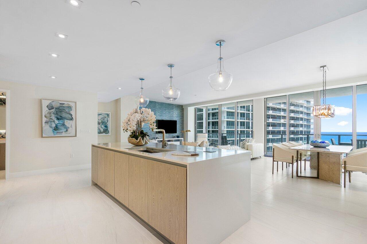 3100 North Ocean Drive, Unit 1505 Riviera Beach, FL 33404 - Photo 7 of 60 a view of a dining room with furniture window and outside view