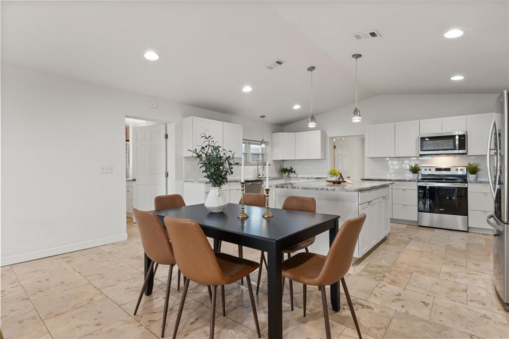 2462 Fort Lane Road Geneva, FL 32732 - Photo 10 of 31 a kitchen with a table and chairs in it