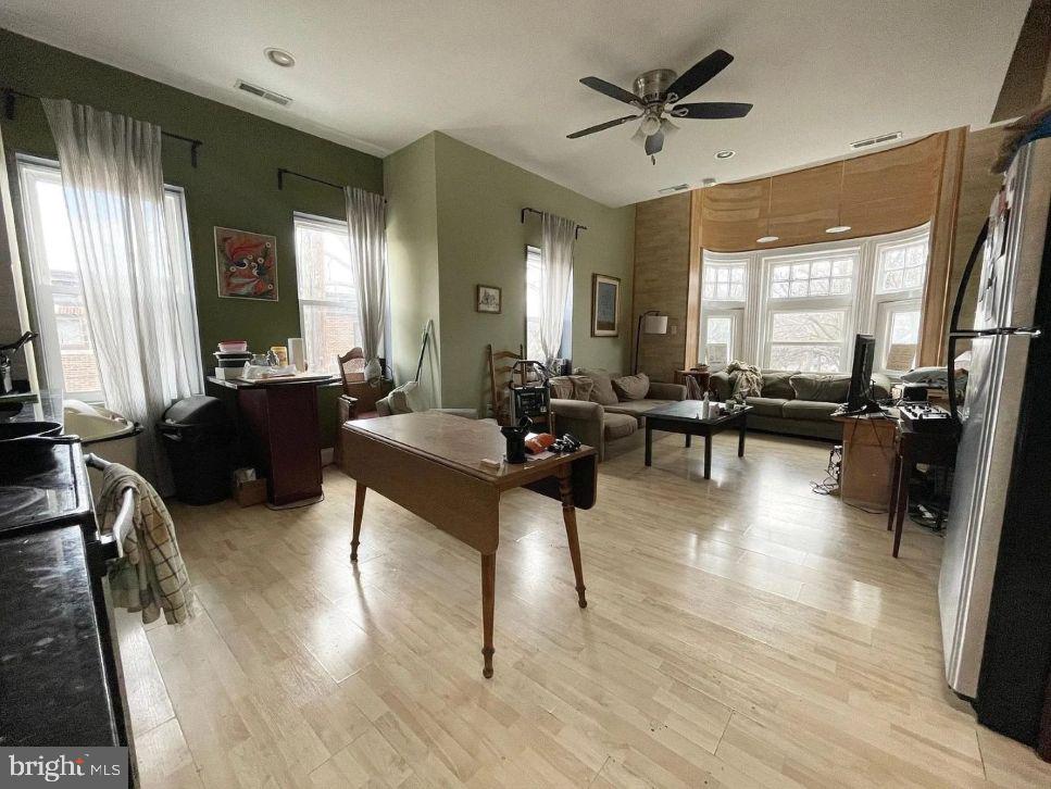 4631 Locust Street Philadelphia, PA 19139 - Photo 4 of 7 a living room with furniture and a large window