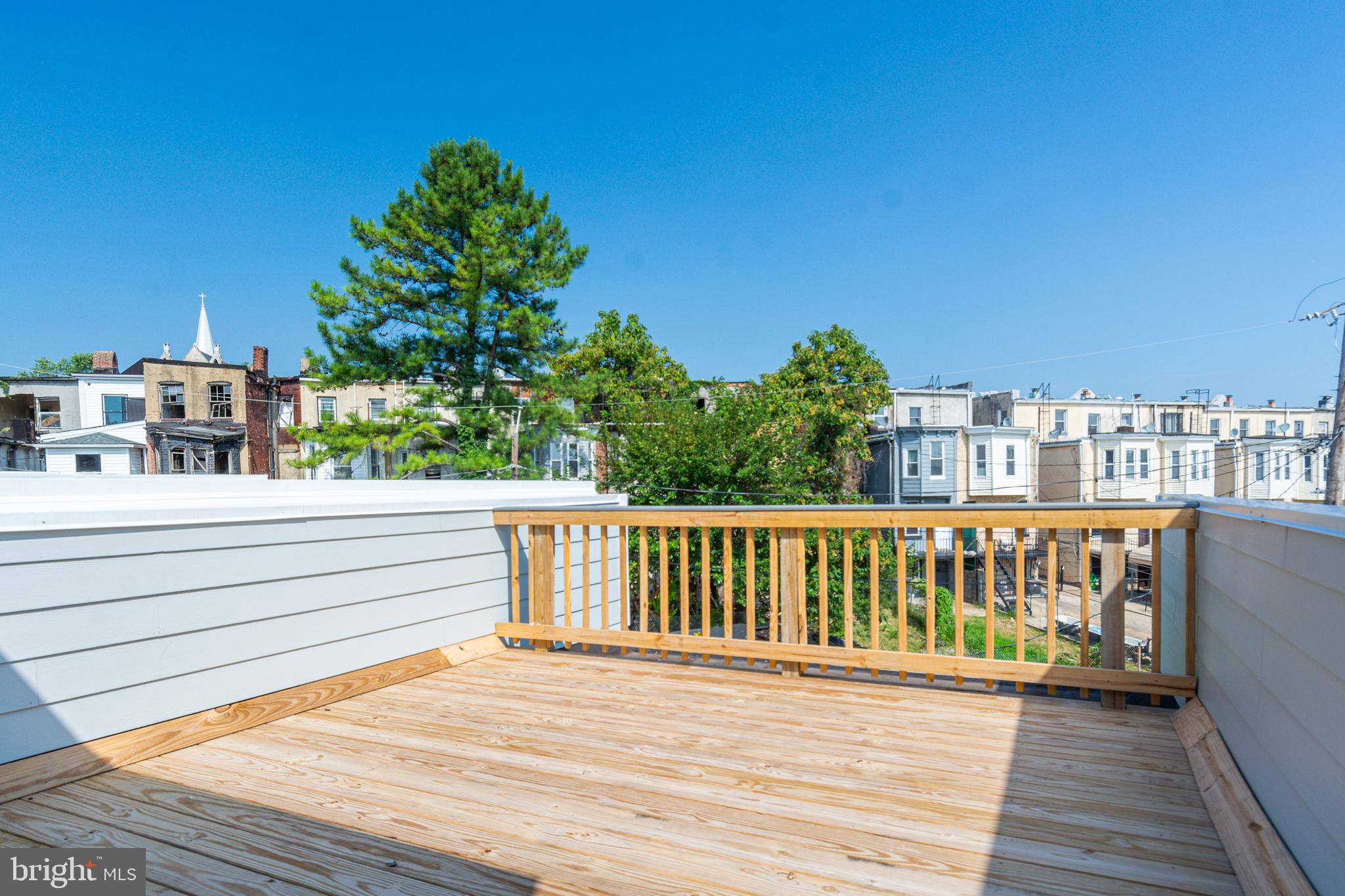 1330 Division Street Baltimore, MD 21217 - Photo 27 of 30 a view of balcony with wooden floor and fence