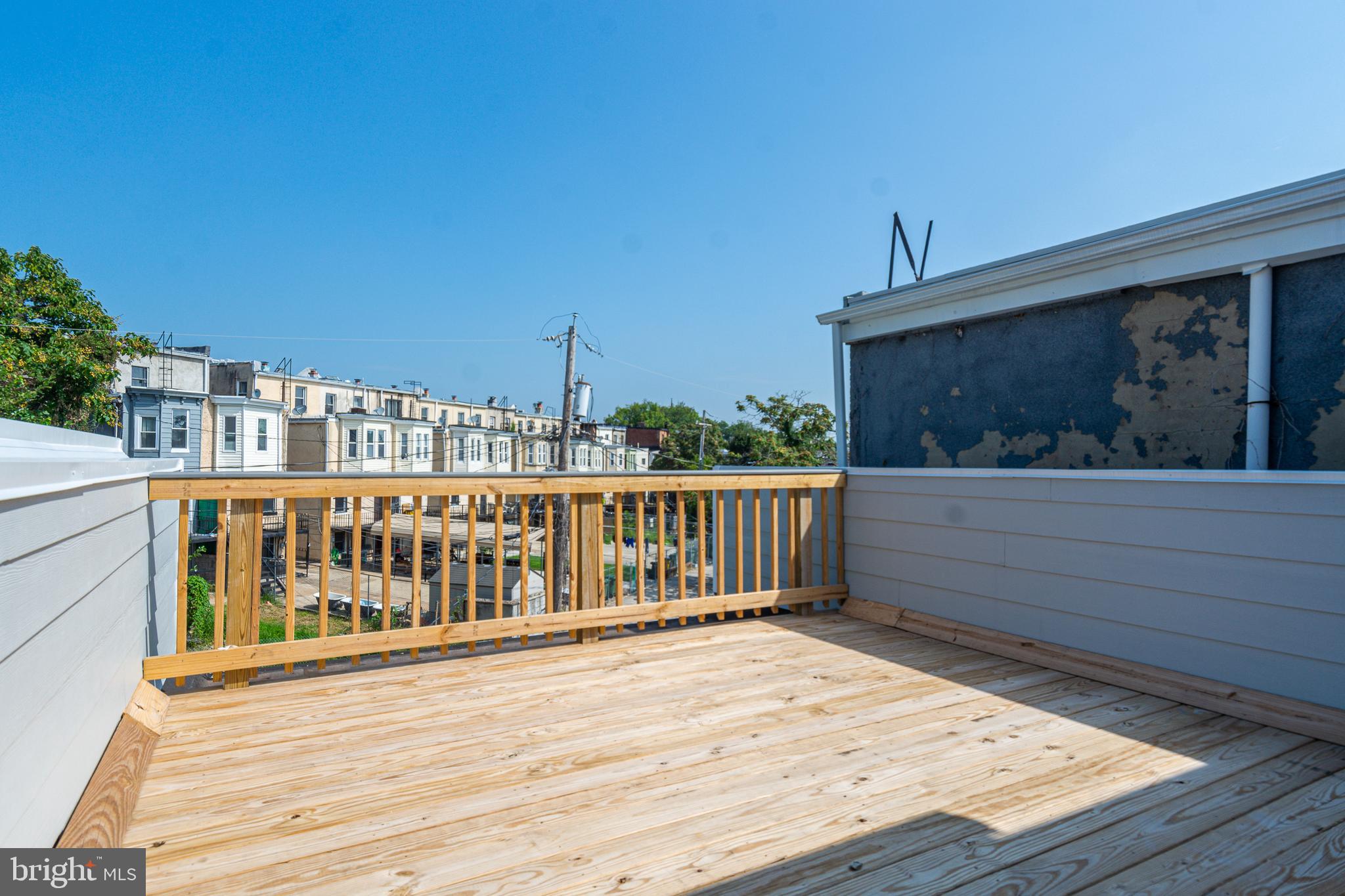 1330 Division Street Baltimore, MD 21217 - Photo 28 of 30 a view of a balcony with wooden fence