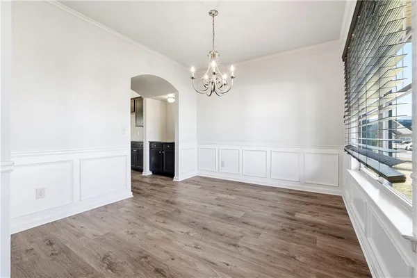 a view of a chandelier in an empty room