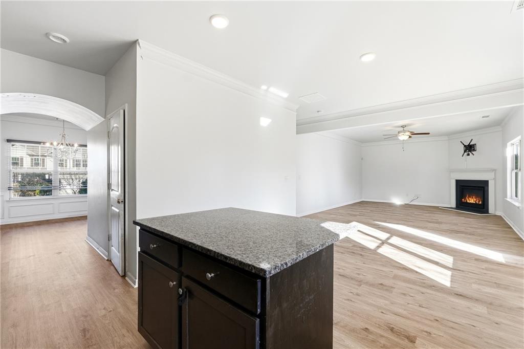677 Massey Street Winder, GA 30680 - Photo 9 of 30 a view of a kitchen cabinets a sink and dishwasher with wooden floor