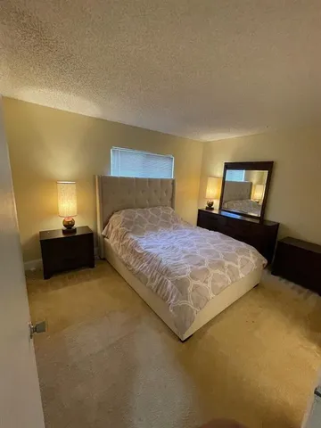 a bathroom with a toilet a sink and shower