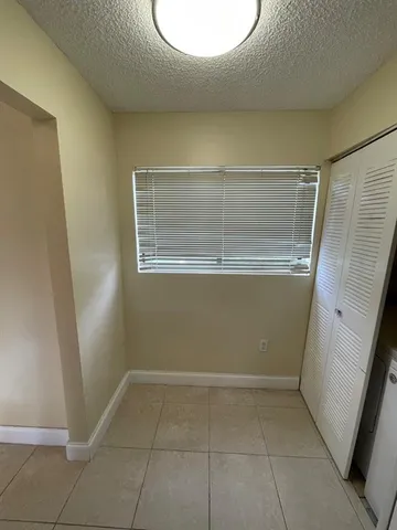 a view of room with window and hardwood floor
