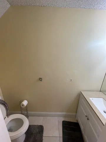 a bathroom with a sink and toilet