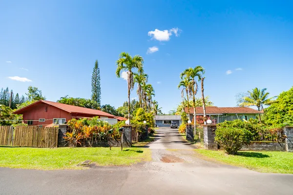 a view of a house with outdoor space and garden