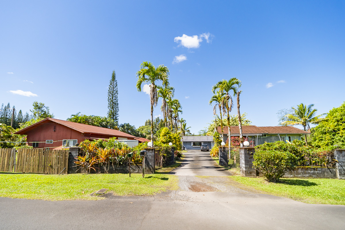 a view of a house with outdoor space and garden
