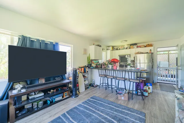 a room with furniture and a flat screen tv