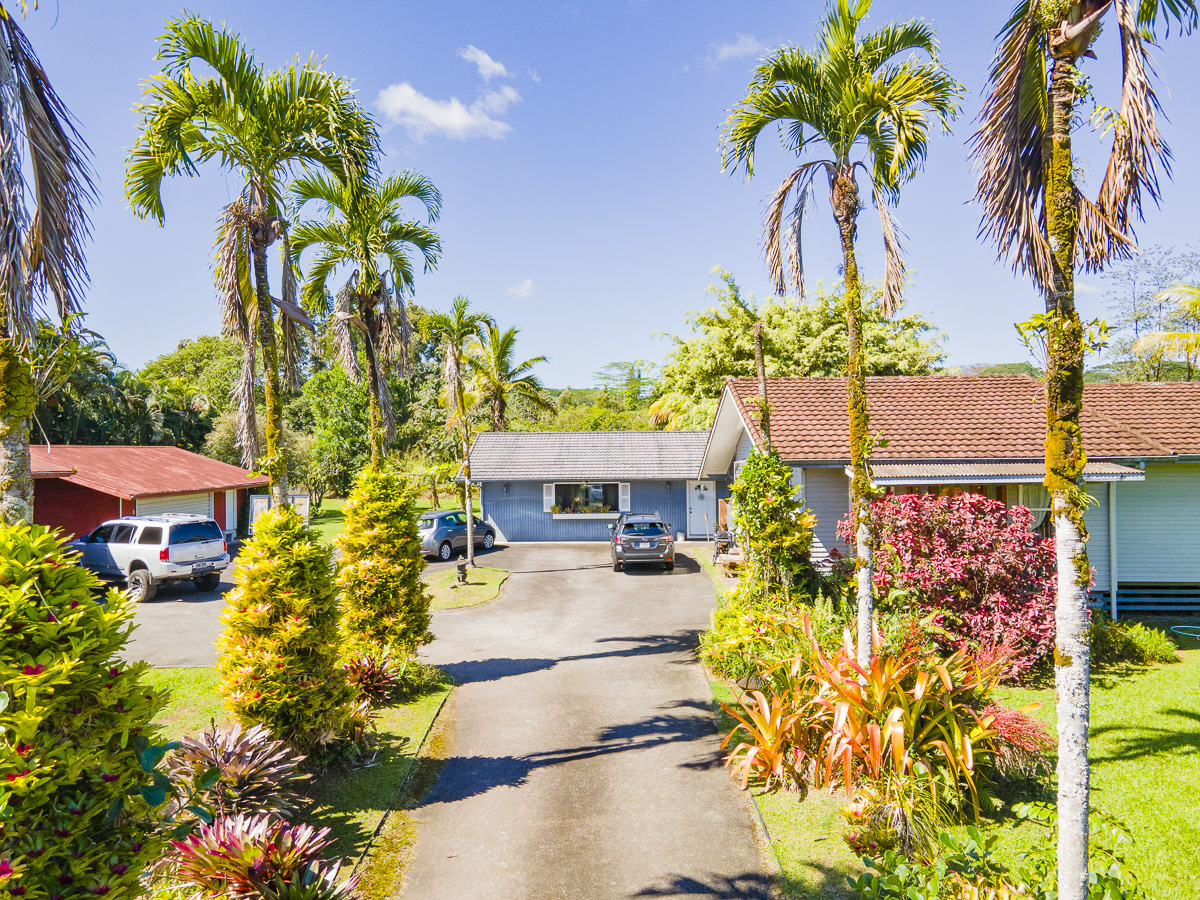 420 Ainalako Road Hilo, HI 96720 - Photo 2 of 20 a front view of a house with a yard and garden