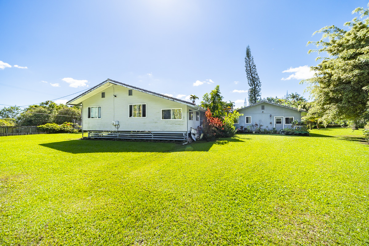 420 Ainalako Road Hilo, HI 96720 - Photo 8 of 20 a front view of a house with yard and swimming pool