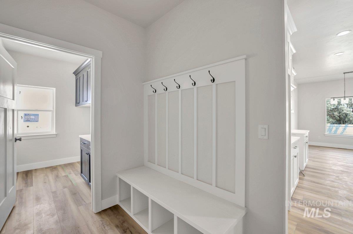 951 Gregory Way Twin Falls, ID 83301 - Photo 18 of 31 Mudroom featuring light wood-style flooring and a chandelier