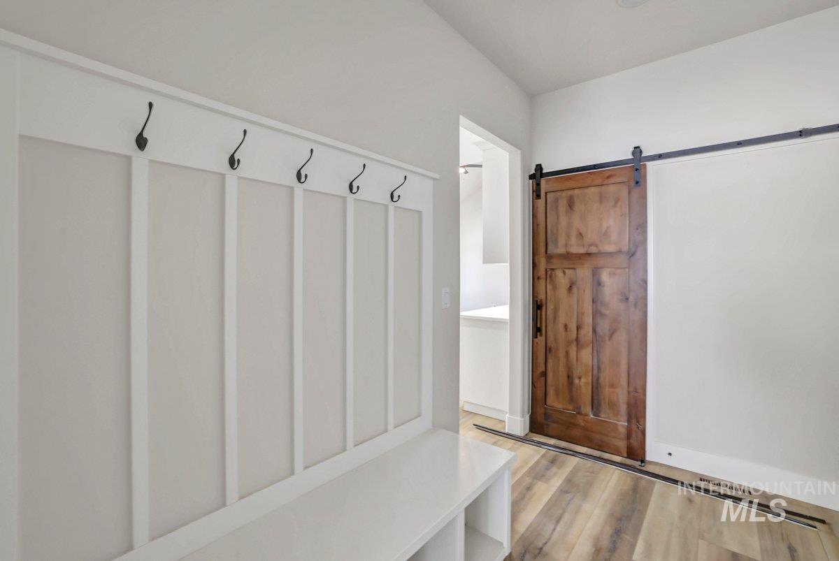 951 Gregory Way Twin Falls, ID 83301 - Photo 20 of 31 Mudroom with wood finished floors and a barn door