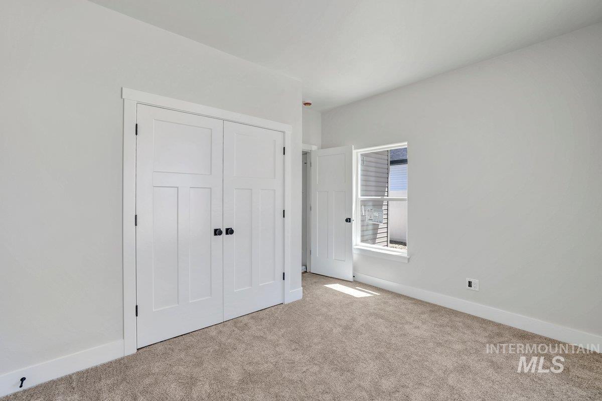 951 Gregory Way Twin Falls, ID 83301 - Photo 22 of 31 Unfurnished bedroom with carpet floors and a closet