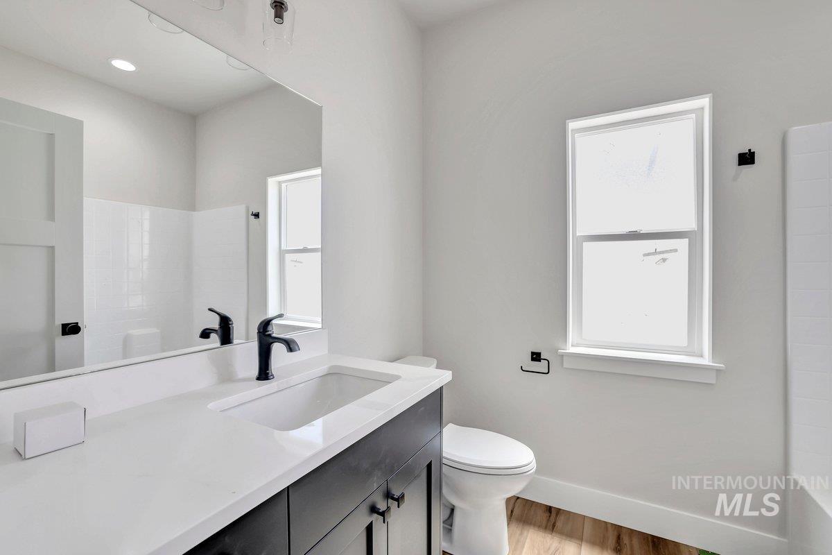 951 Gregory Way Twin Falls, ID 83301 - Photo 23 of 31 Bathroom with vanity and wood finished floors