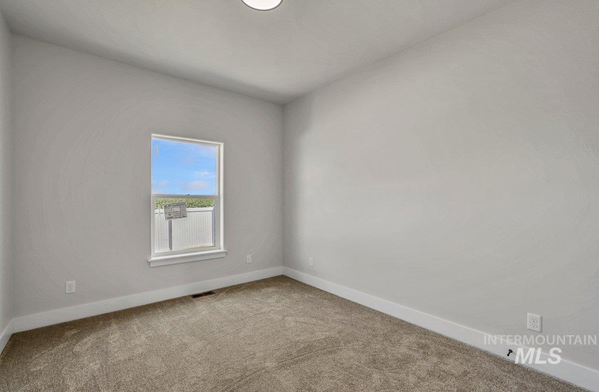 951 Gregory Way Twin Falls, ID 83301 - Photo 24 of 31 Empty room with carpet and baseboards