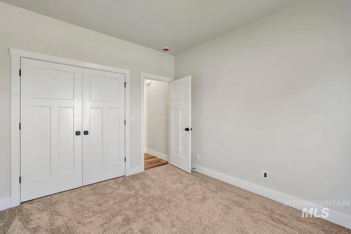 951 Gregory Way Twin Falls, ID 83301 - Photo 25 of 31 Unfurnished bedroom featuring carpet floors and a closet