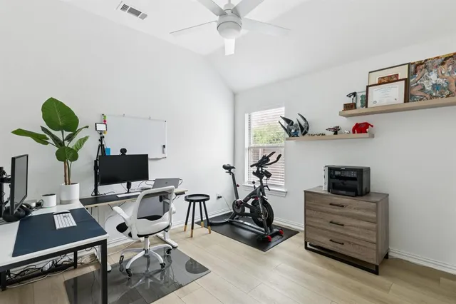 a work room with furniture and a window