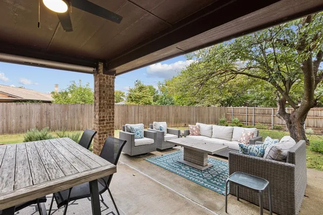 a outdoor living space with patio furniture and a potted plant
