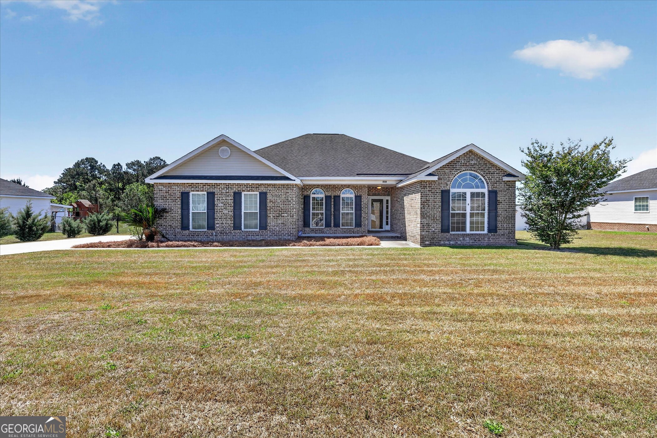 245 Stonebrook Way Statesboro, GA 30458 - Photo 1 of 32 a front view of a house with swimming pool having outdoor seating