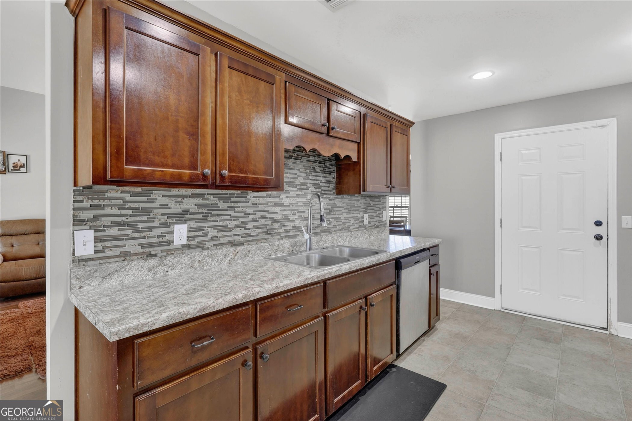 245 Stonebrook Way Statesboro, GA 30458 - Photo 15 of 32 a kitchen with granite countertop stainless steel appliances a sink and cabinets
