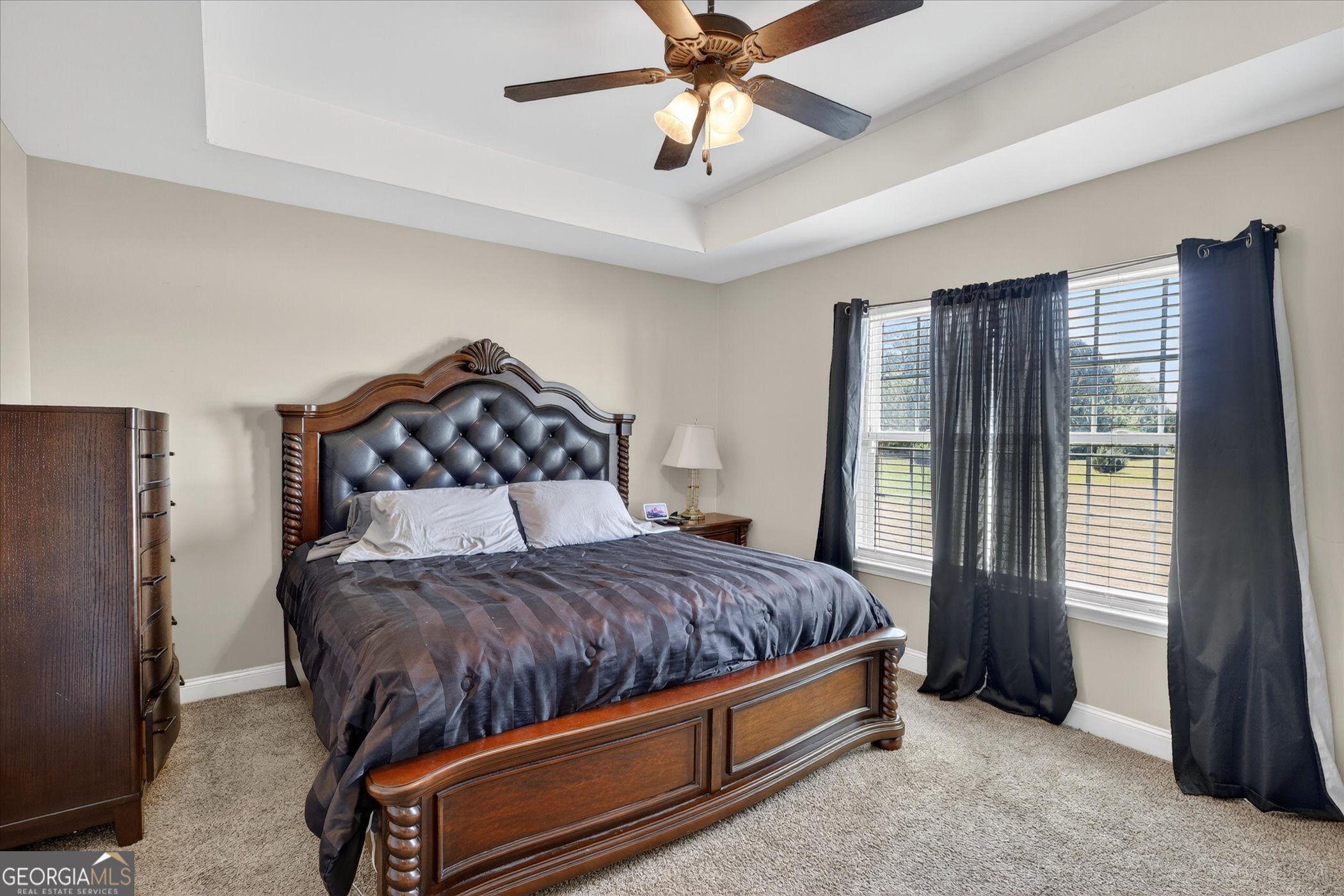 245 Stonebrook Way Statesboro, GA 30458 - Photo 17 of 32 a bedroom with a bed and a chandelier