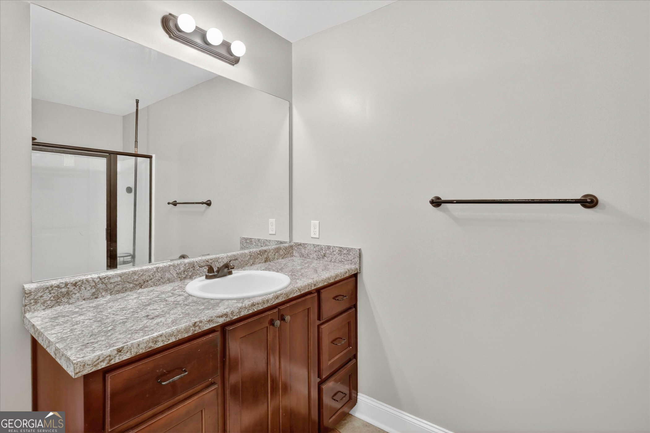 245 Stonebrook Way Statesboro, GA 30458 - Photo 18 of 32 a bathroom with a granite countertop sink and a mirror