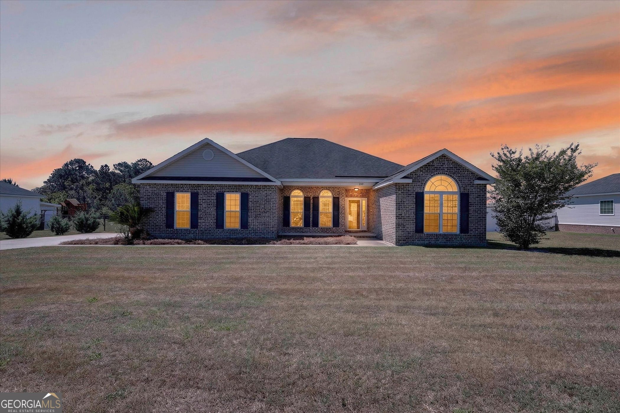 245 Stonebrook Way Statesboro, GA 30458 - Photo 2 of 32 a front view of a house with a garden