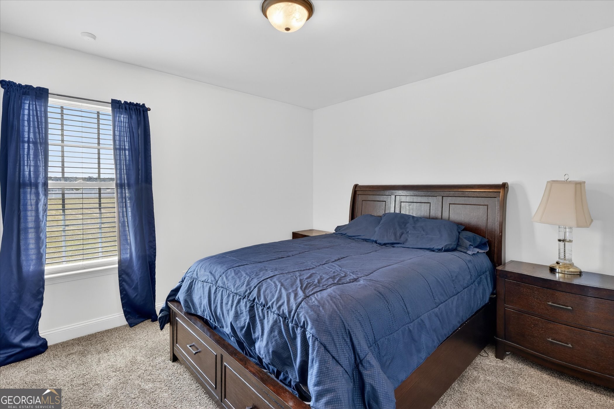 245 Stonebrook Way Statesboro, GA 30458 - Photo 25 of 32 a bedroom with a bed and a window