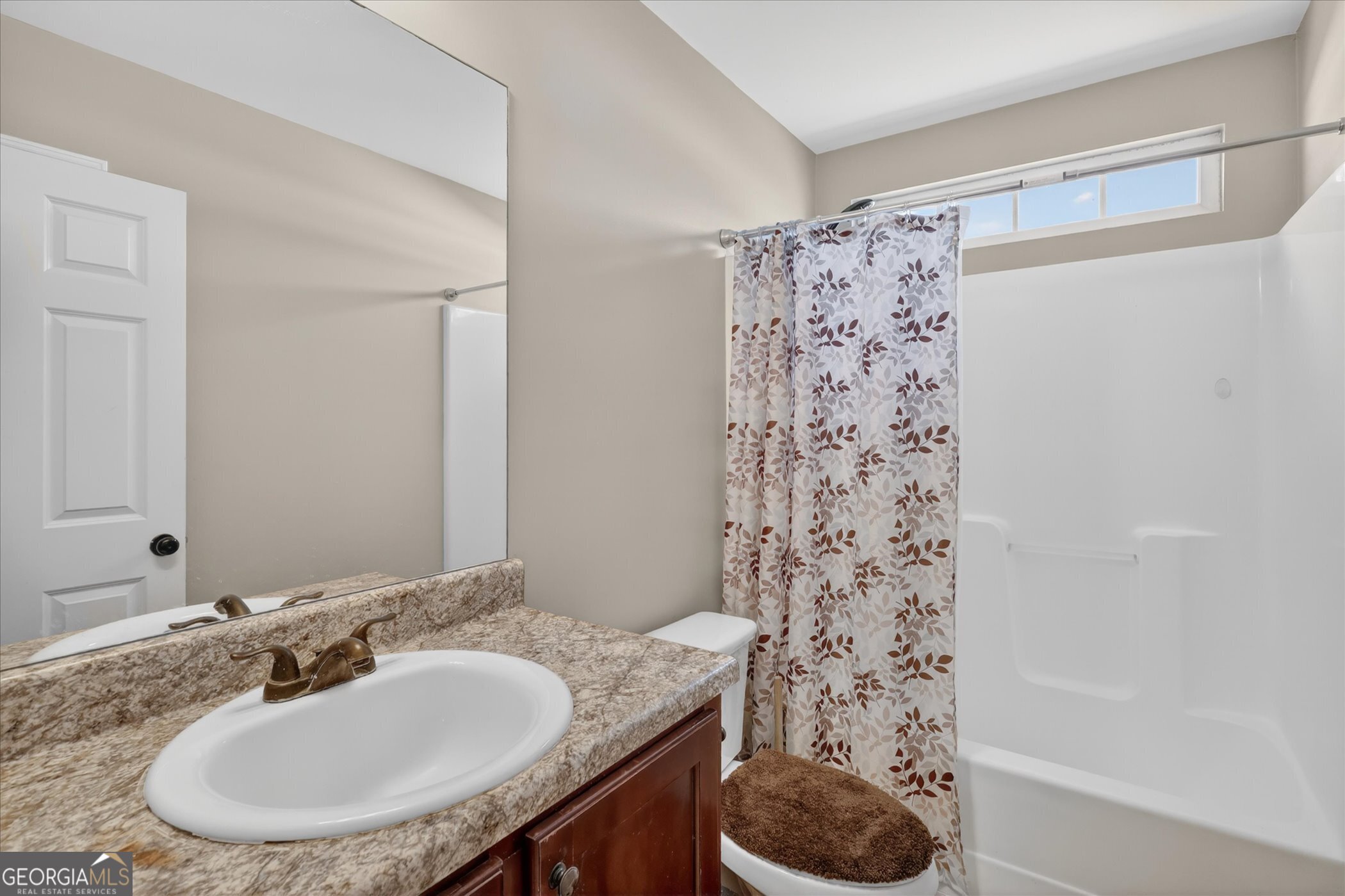 245 Stonebrook Way Statesboro, GA 30458 - Photo 26 of 32 a bathroom with a sink a toilet and a mirror