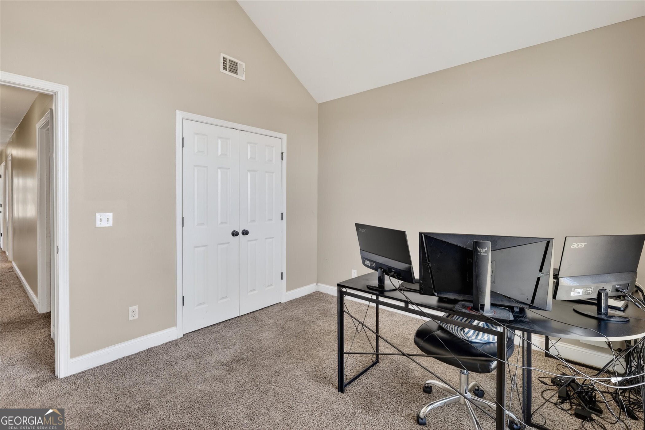 245 Stonebrook Way Statesboro, GA 30458 - Photo 27 of 32 a view of a livingroom with furniture and a flat screen tv