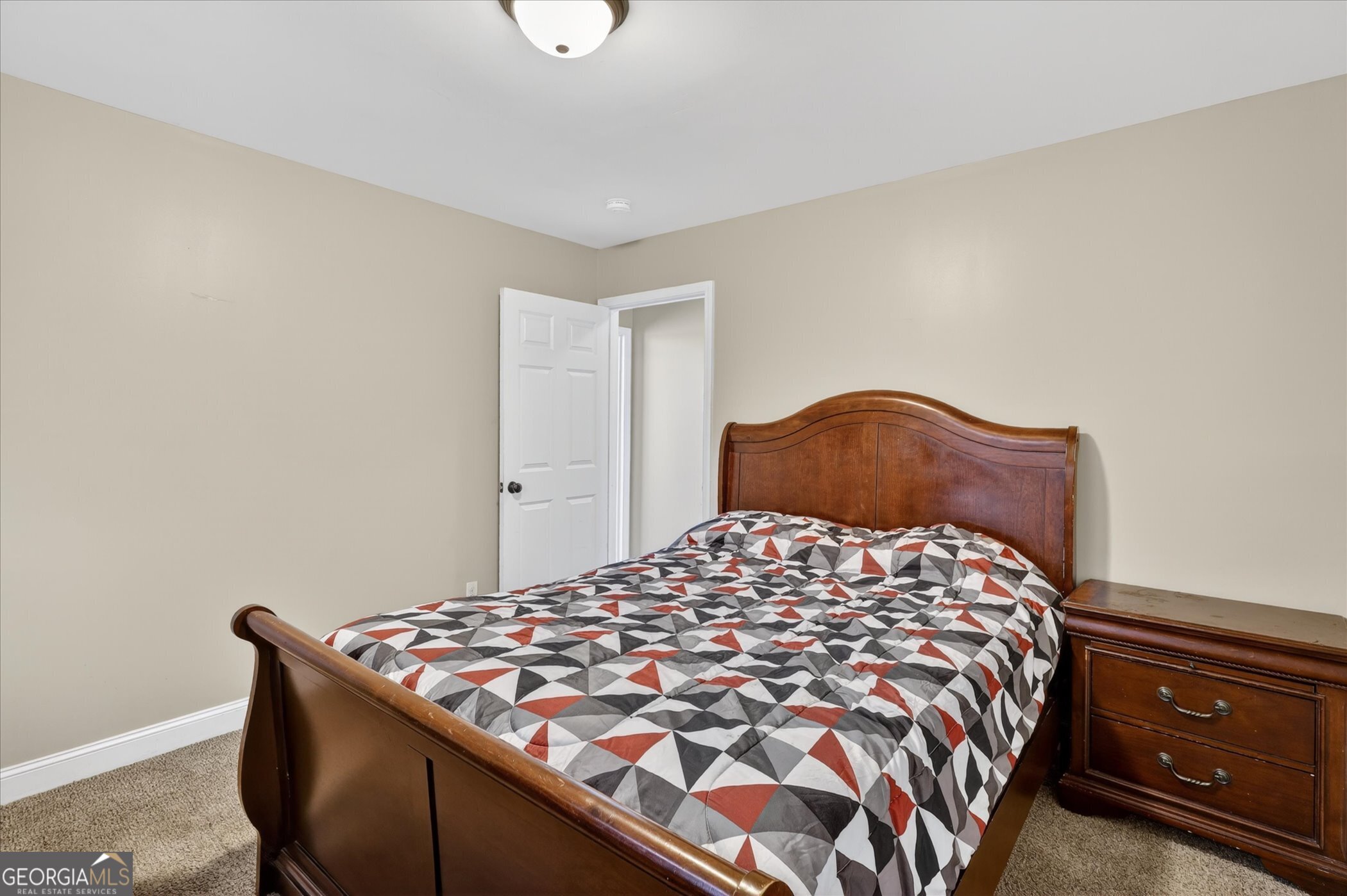 245 Stonebrook Way Statesboro, GA 30458 - Photo 28 of 32 a bedroom with a bed and a cabinets