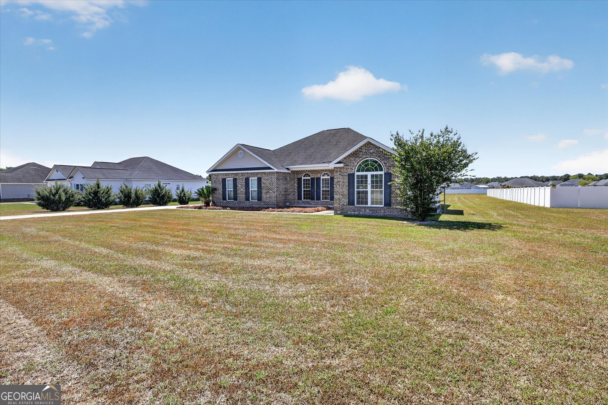 245 Stonebrook Way Statesboro, GA 30458 - Photo 3 of 32 a view of a house with a yard and a large tree