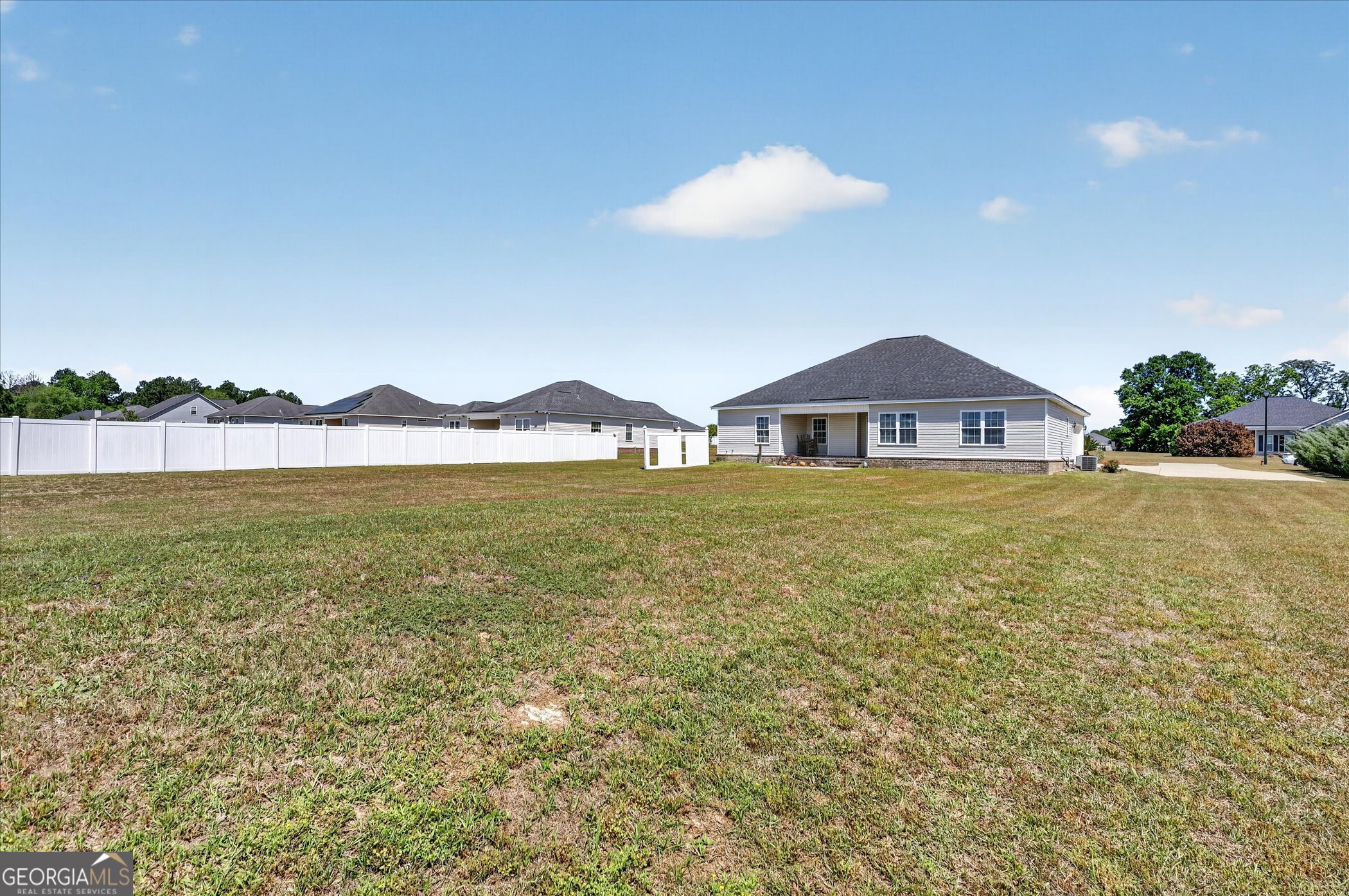 245 Stonebrook Way Statesboro, GA 30458 - Photo 32 of 32 a view of a house with a yard and a large tree