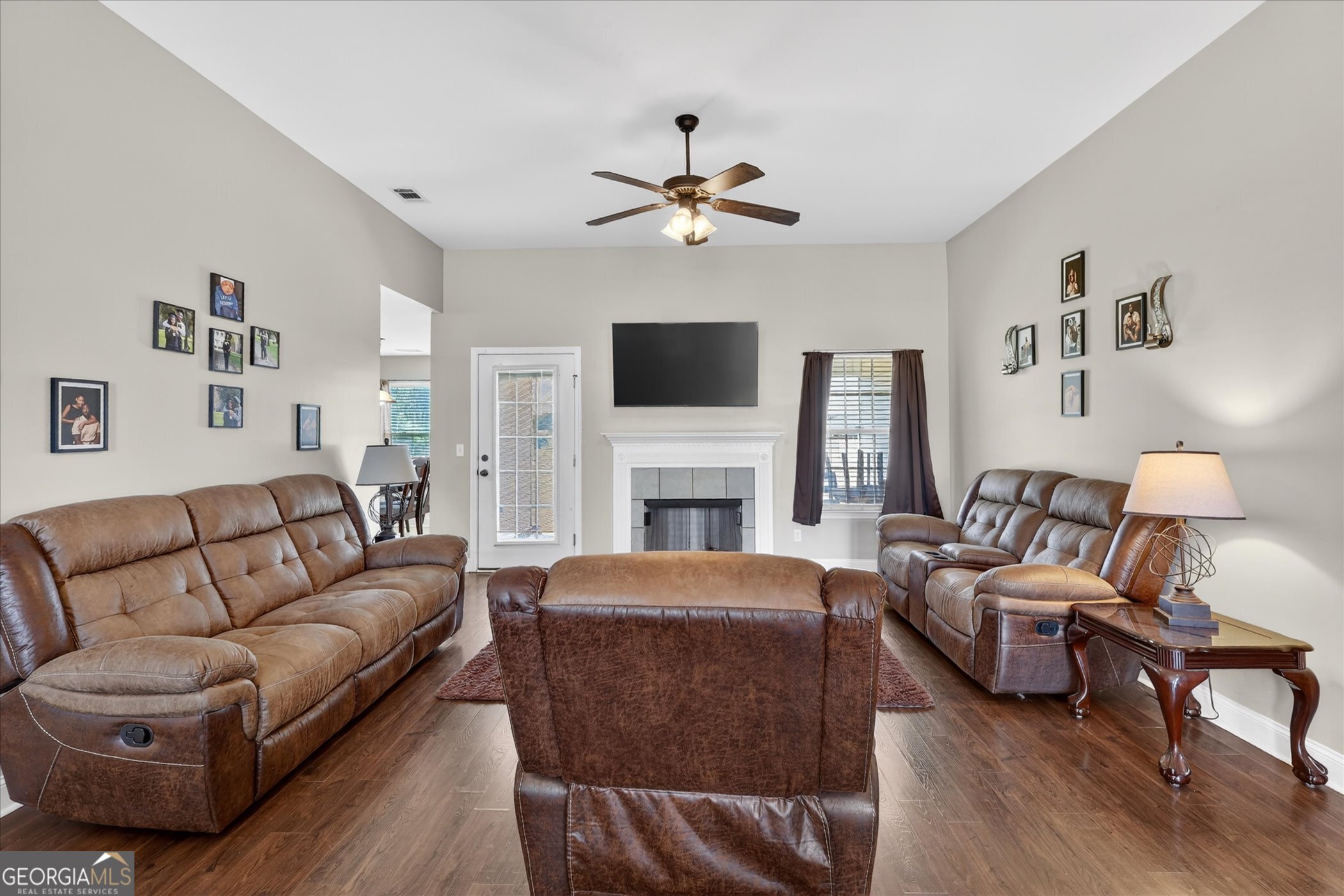 245 Stonebrook Way Statesboro, GA 30458 - Photo 5 of 32 a living room with fireplace furniture and a flat screen tv