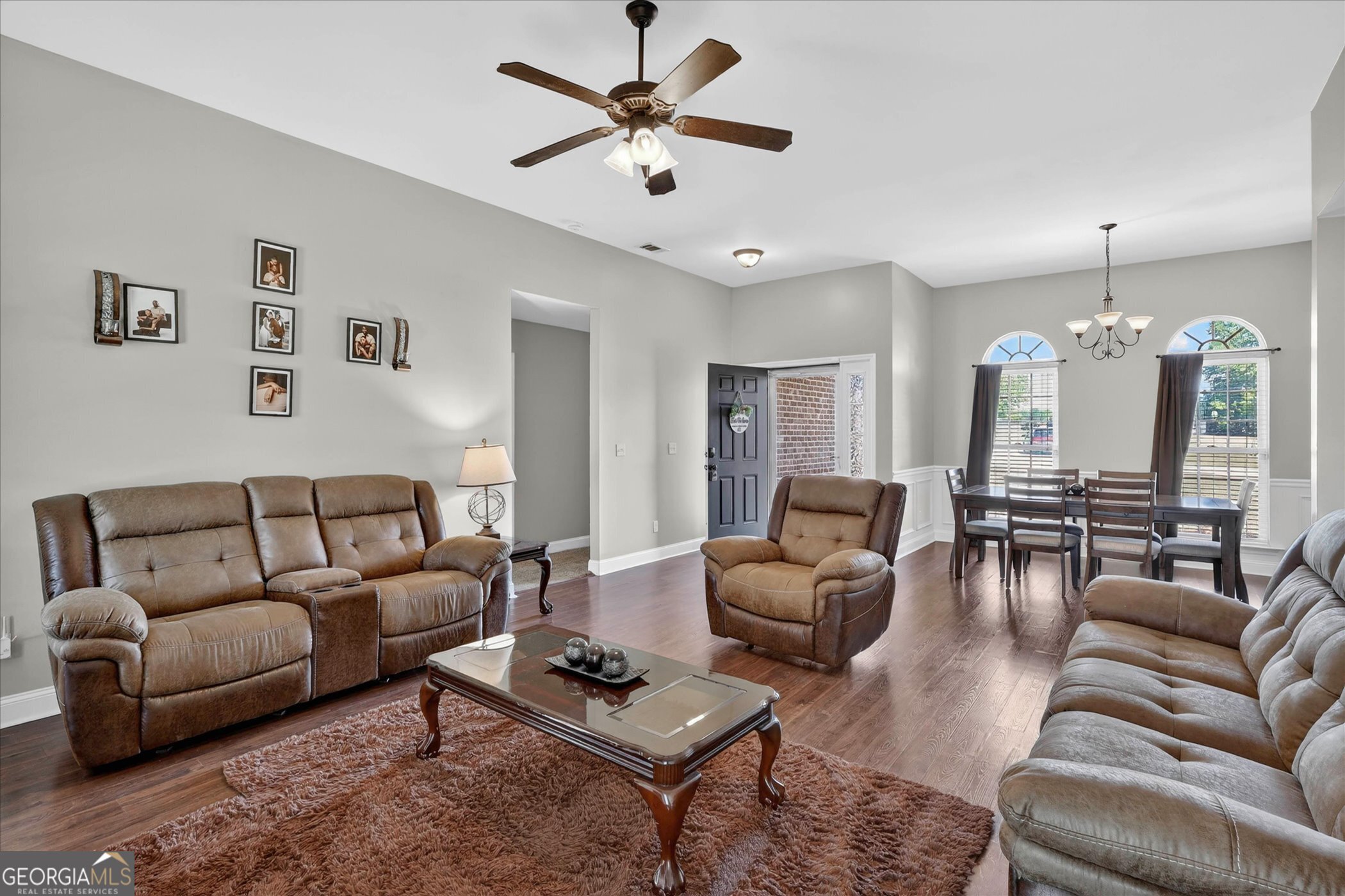 245 Stonebrook Way Statesboro, GA 30458 - Photo 6 of 32 a living room with furniture ceiling fan and a rug