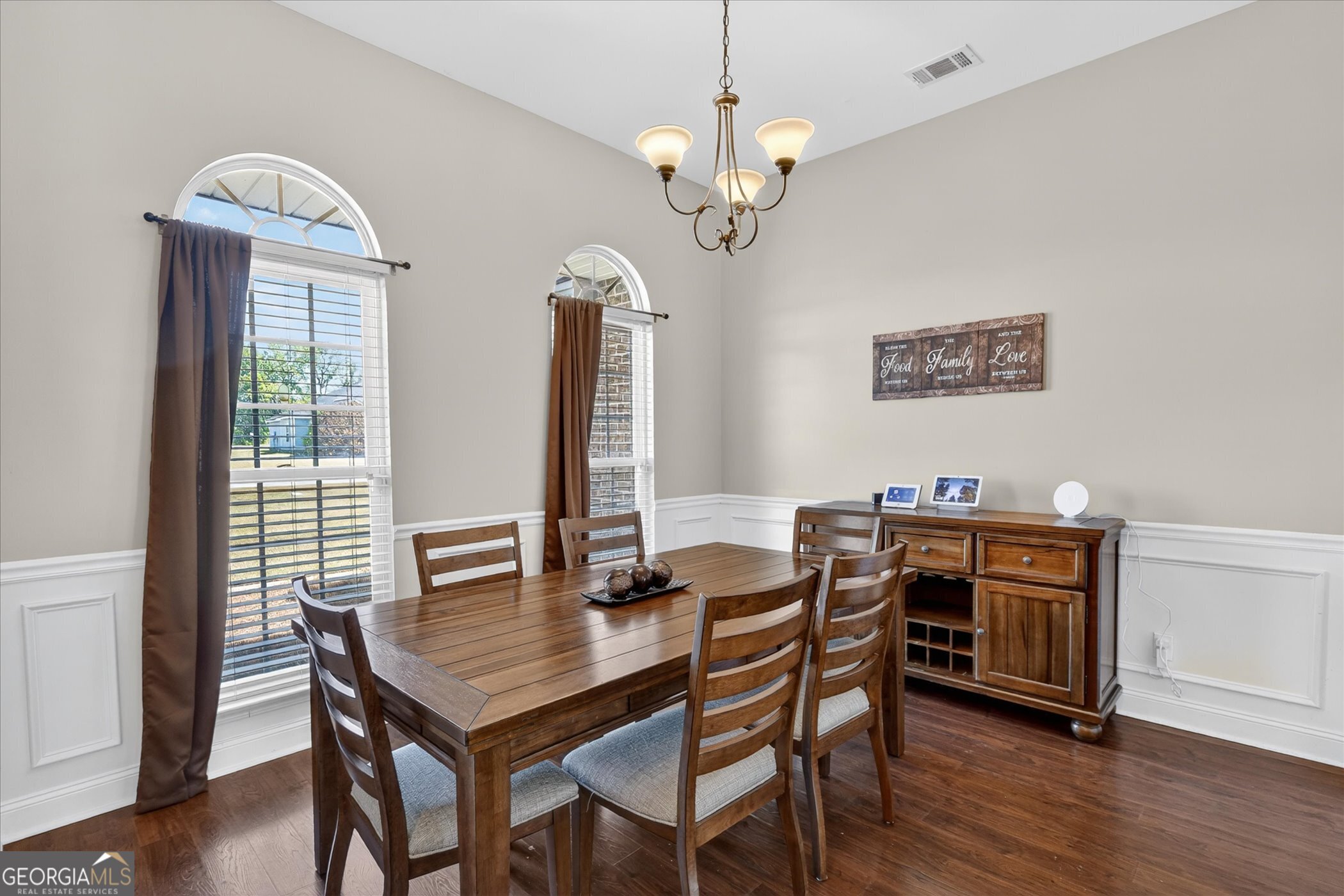 245 Stonebrook Way Statesboro, GA 30458 - Photo 9 of 32 a view of a dining room with furniture window and wooden floor