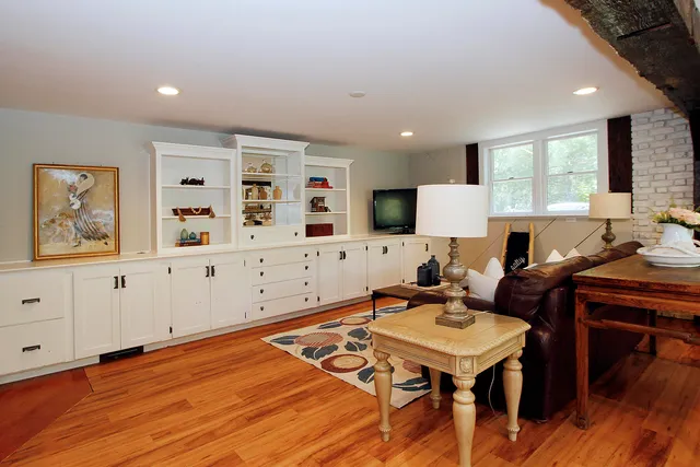 a room with a dresser and a window