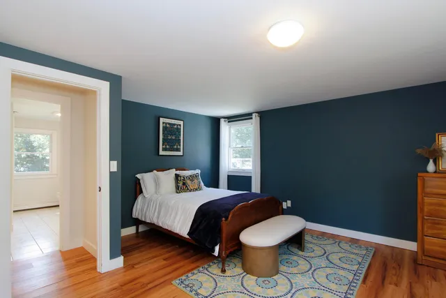 a view of front door with wooden floor