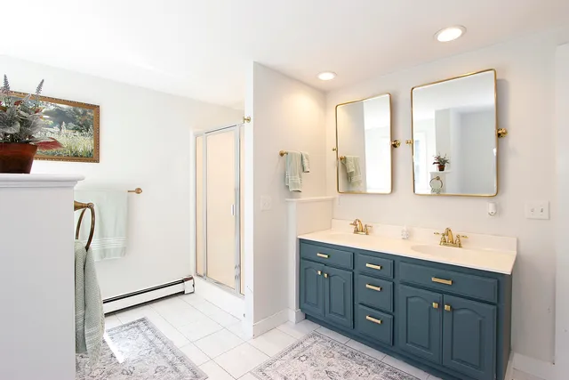 a kitchen with stainless steel appliances white cabinets and a sink