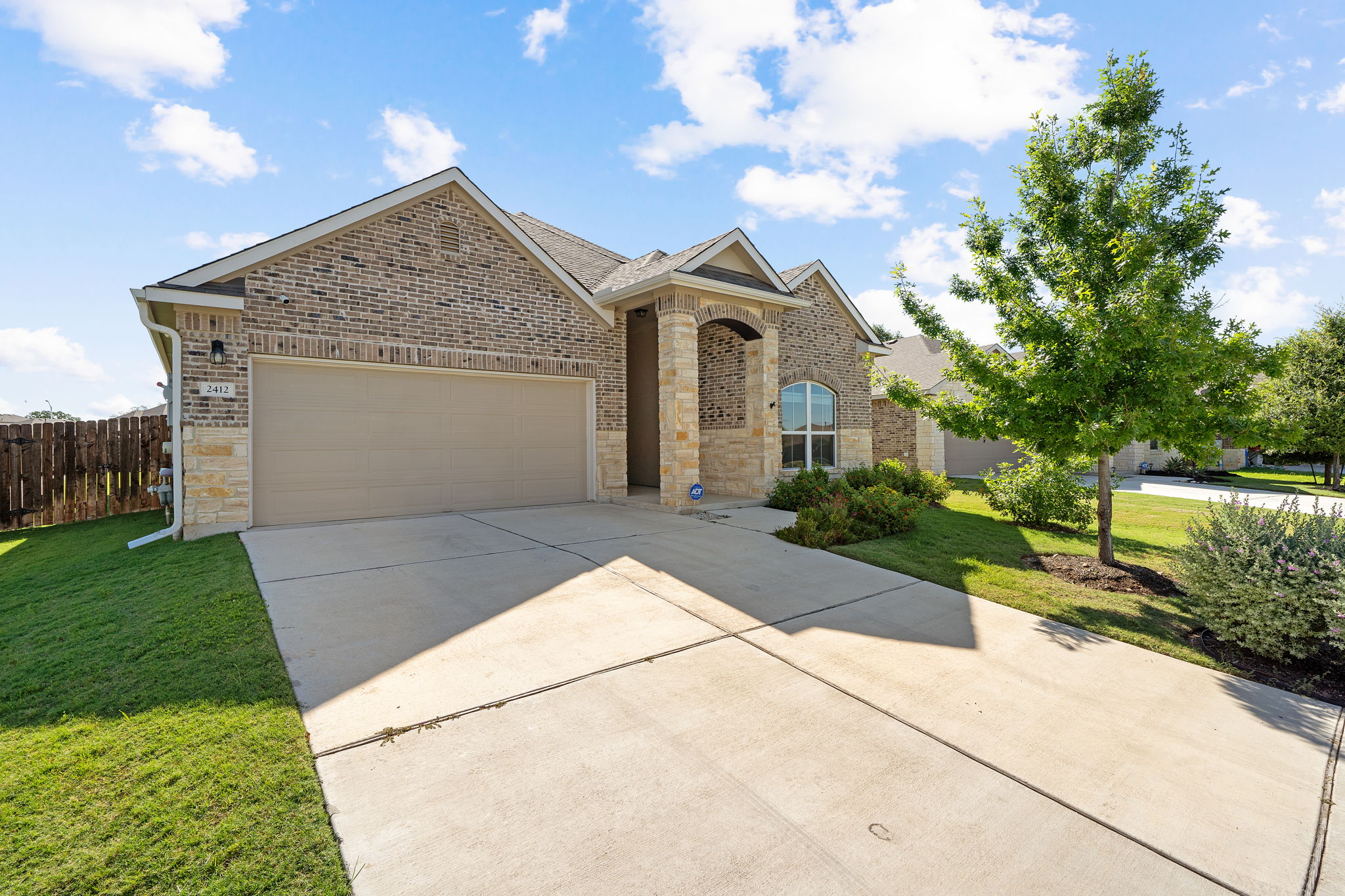 2412 Starhill Ranch Street Georgetown, TX 78628 - Photo 3 of 40 A classic brick exterior with stone accents provides a welcoming curb appeal to this inviting home.