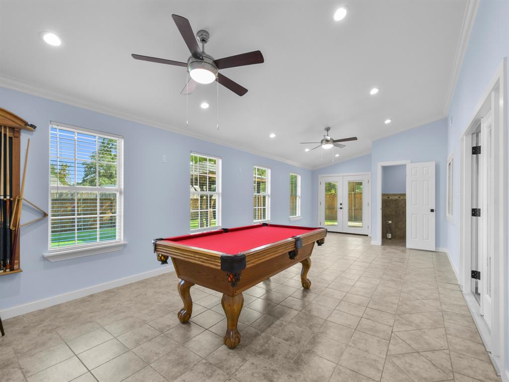 2033 Lymington Road Carrollton, TX 75007 - Photo 17 of 33 Spacious room with vaulted ceilings, recessed lighting, ceiling fans, multiple windows, and tile flooring