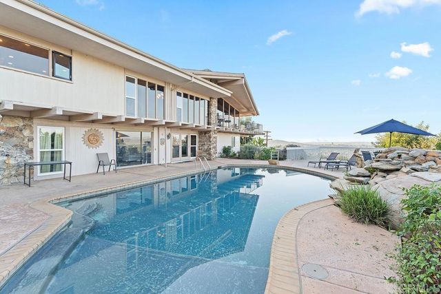a view of an entryway with furniture and windows