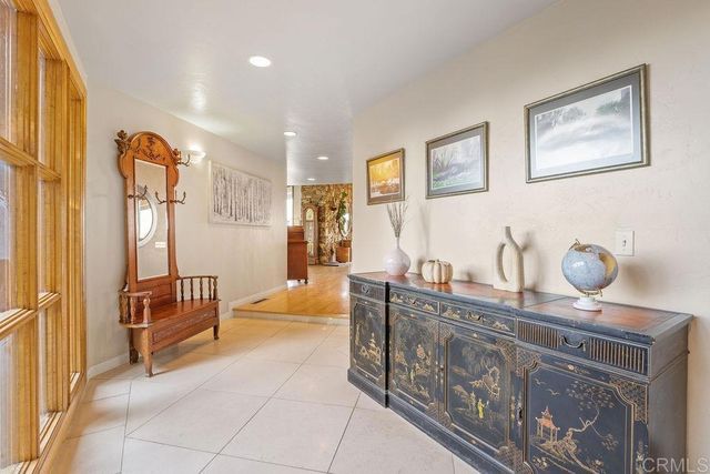 a kitchen with stainless steel appliances granite countertop a refrigerator and a stove