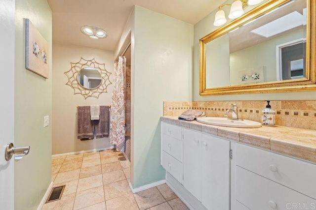 a living room with furniture and large window