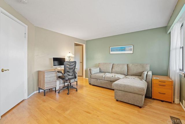 a bedroom with a bed rug and a bed