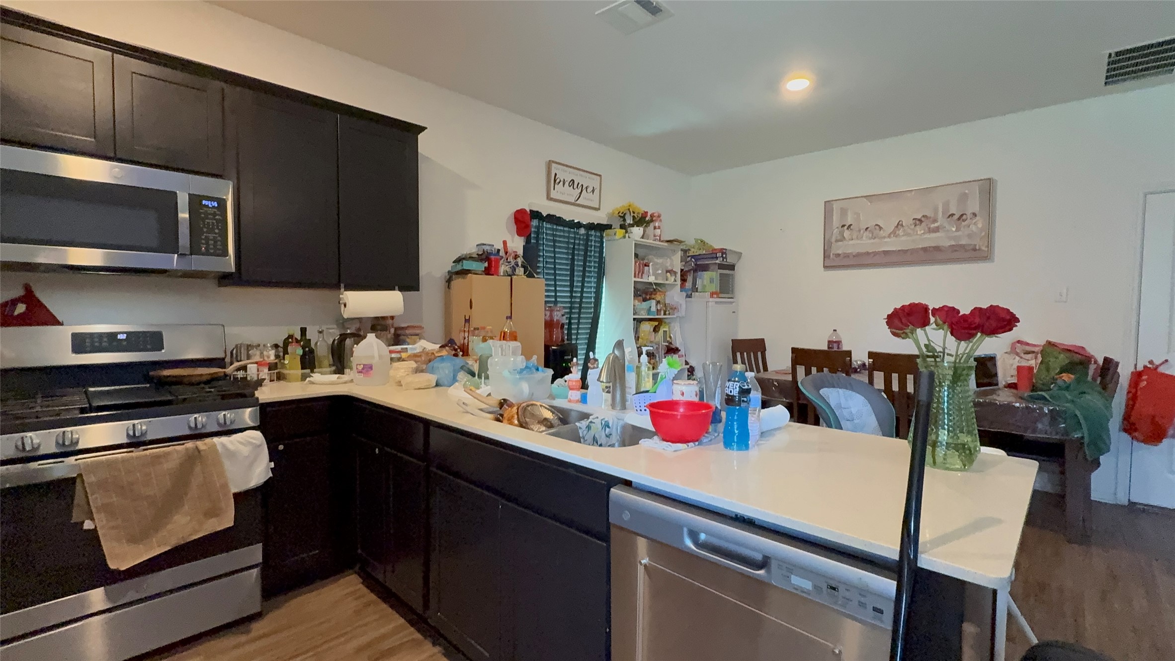 316 Geode Glen Maxwell, TX 78656 - Photo 7 of 24 a kitchen with a sink cabinets and wooden floor