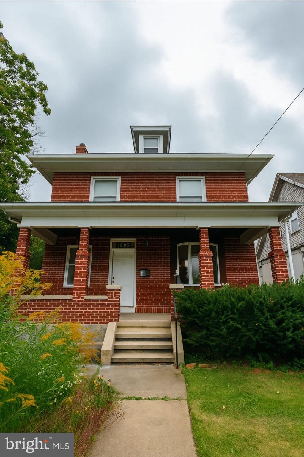 2622 Perkiomen Avenue Reading, PA 19606 - Photo 1 of 27 a front view of a house with garden