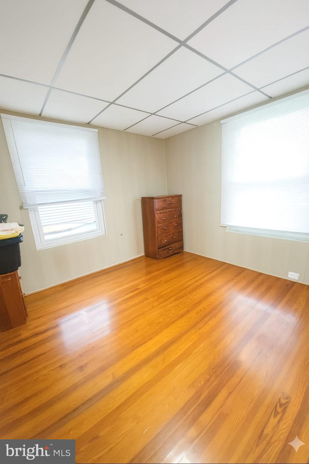 2622 Perkiomen Avenue Reading, PA 19606 - Photo 12 of 27 an empty room with wooden floor and windows