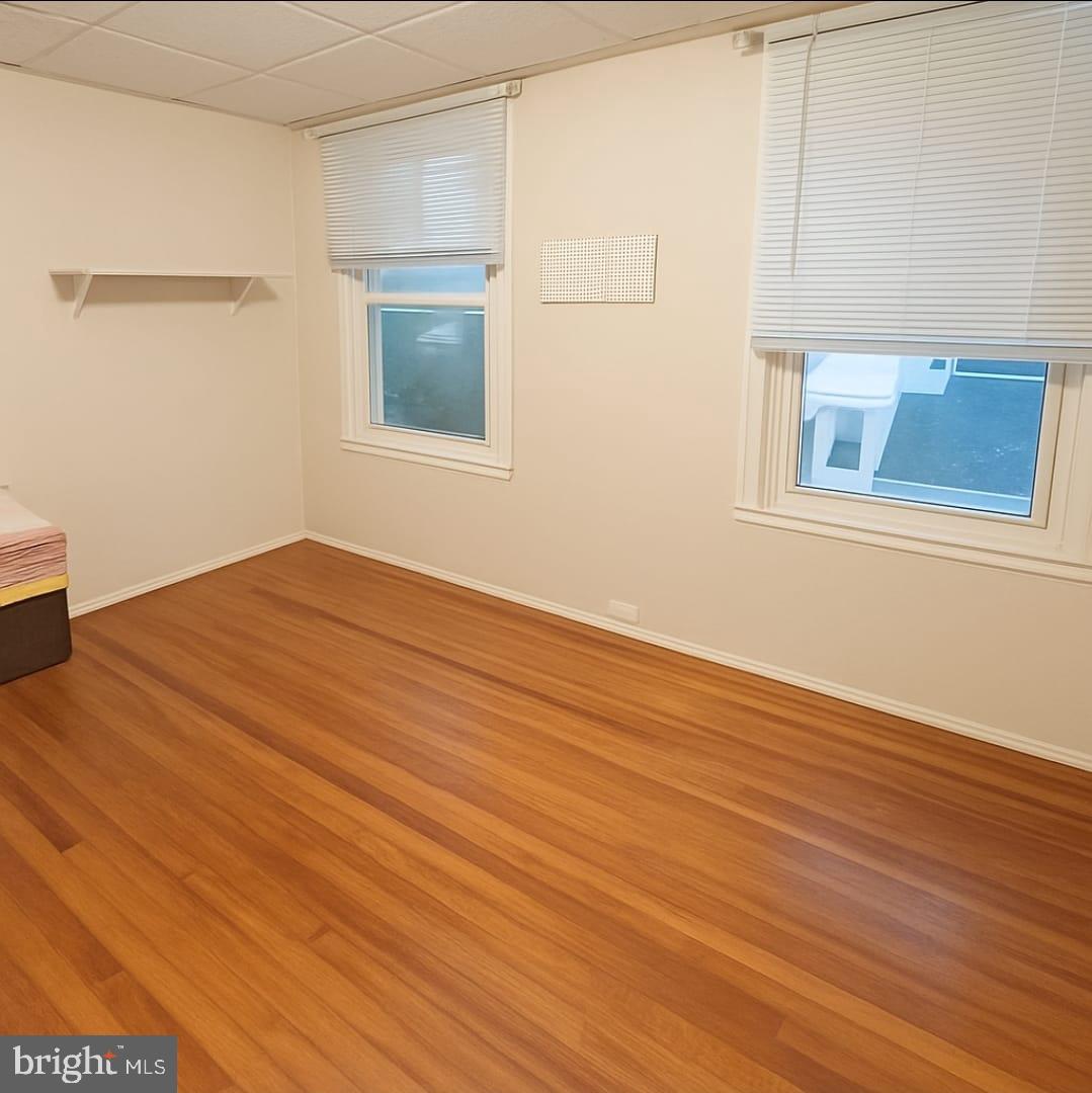 2622 Perkiomen Avenue Reading, PA 19606 - Photo 13 of 27 a view of an empty room with wooden floor and a window